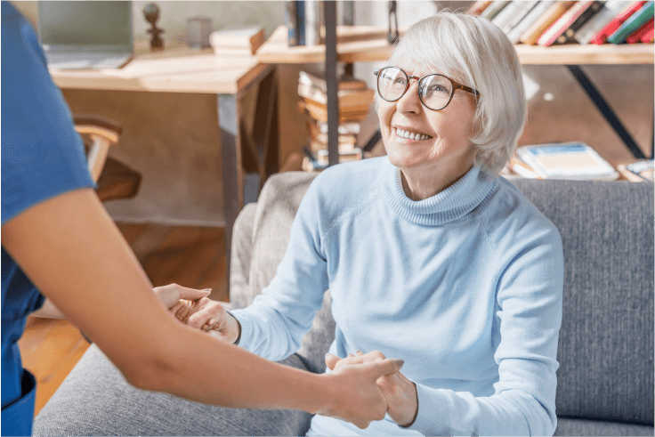 nurse-holding-woman-hands