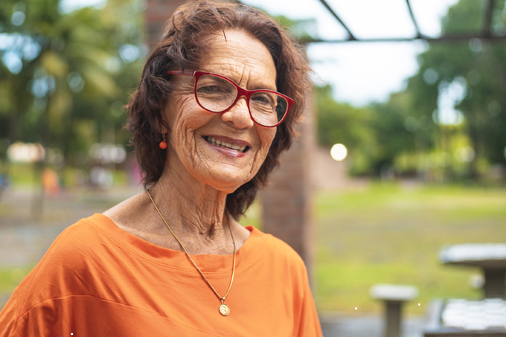 woman smiling outside in picnic area