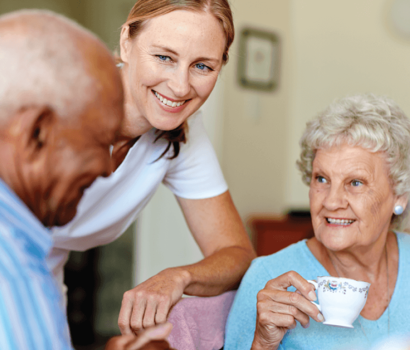 Employee helping senior couple