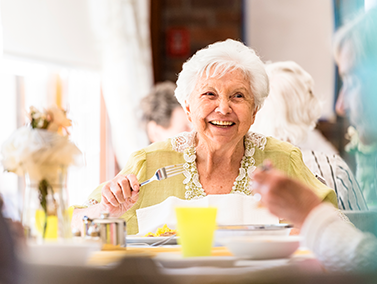 woman smiling dining