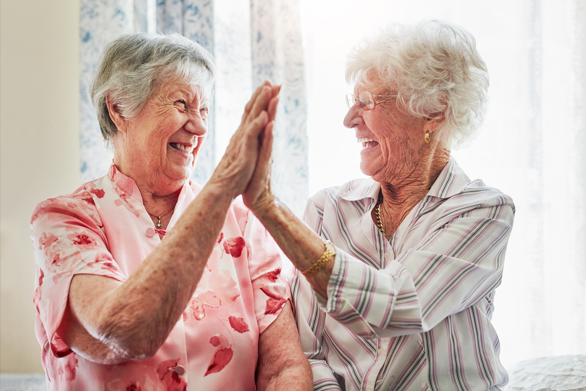 Two people high fiving