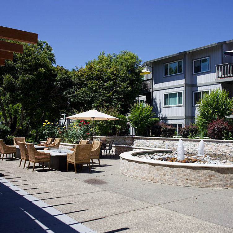 Community courtyard space with a fountain and seating